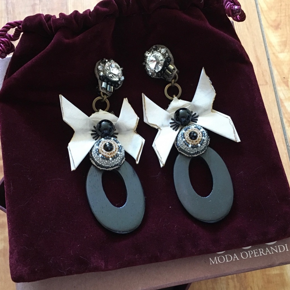 Never worn designer long clip-on earrings